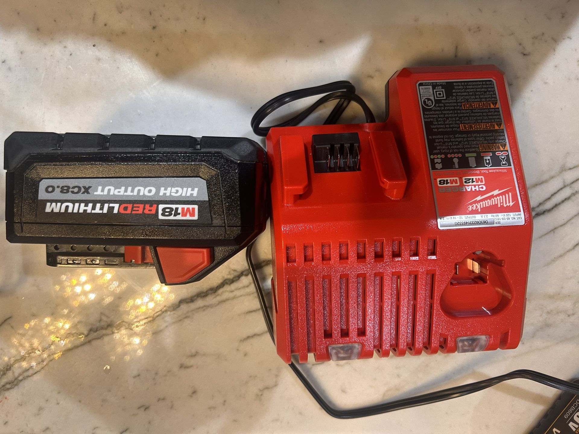 MILWAUKEE BATTERY AND CHARGER