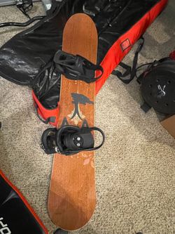 arbor abacus snowboard with all the snow gear.