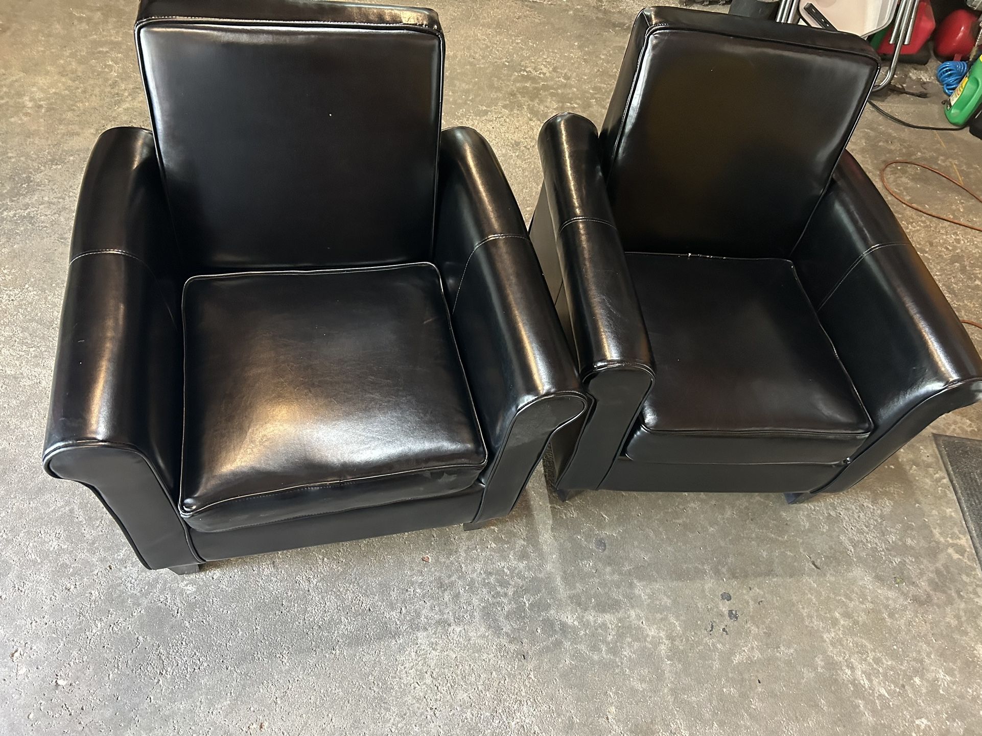 Set Of Black Chairs 32” Tall 30” X 28” Wide In good condition, no tears or rips.