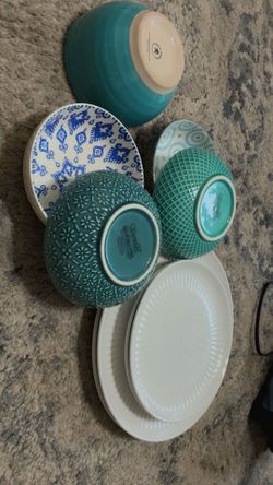 4 porcelain plates and 5 ceramic bowls