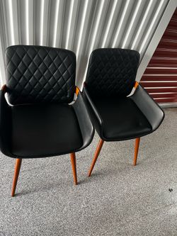 2 black lobby chairs