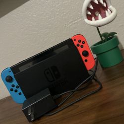 Nintendo Switch (Neon Blue & Red) – Great Condition 💙 ❤️