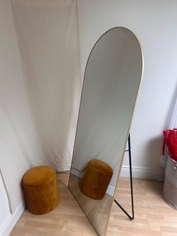 gold arched full-length floor mirror