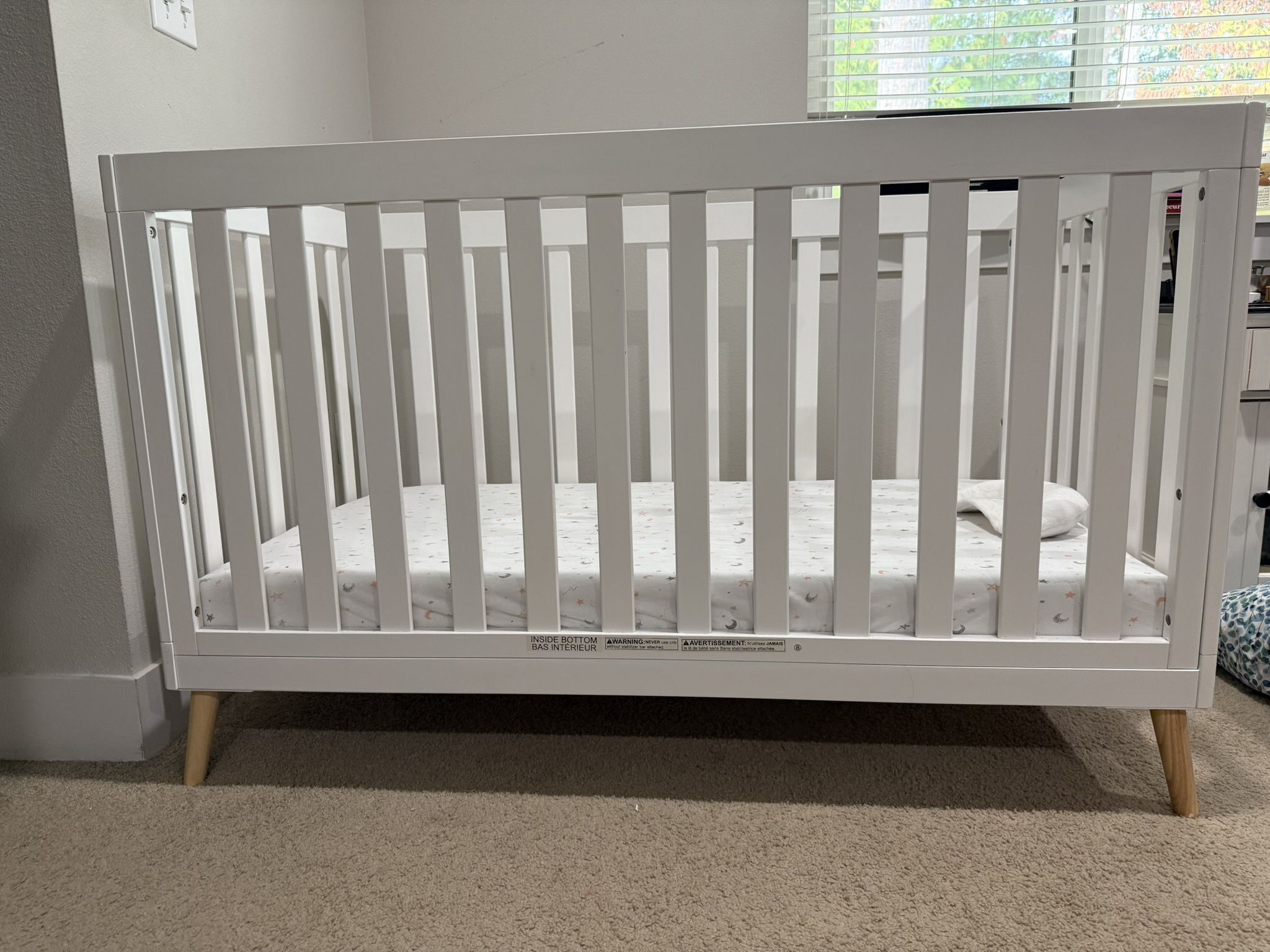Delta Children Essex 4-in-1 Convertible Baby Crib, Bianca White with Natural Legs