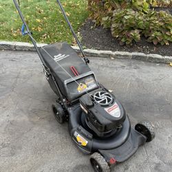 Lawnmower that you push and it takes gas comes with bag 