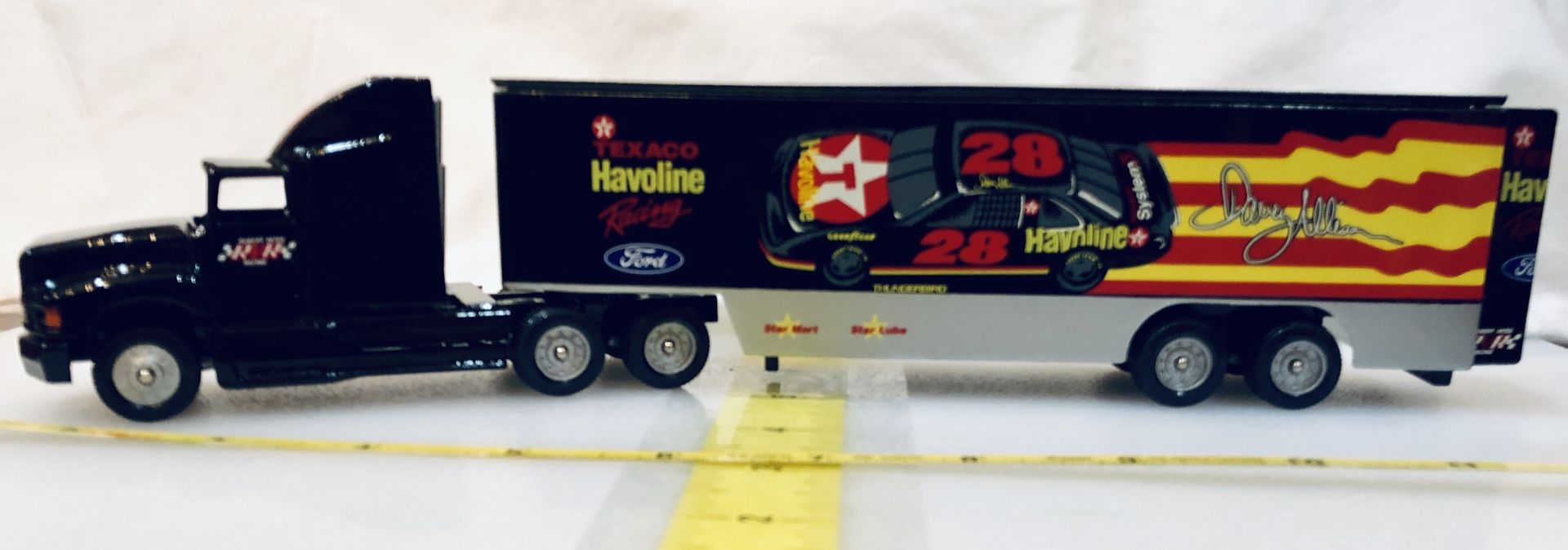 Davey Allison Texaco / Havoline Racing Hauler #28, 1:64. It is #19 in the American Racing Scene series.