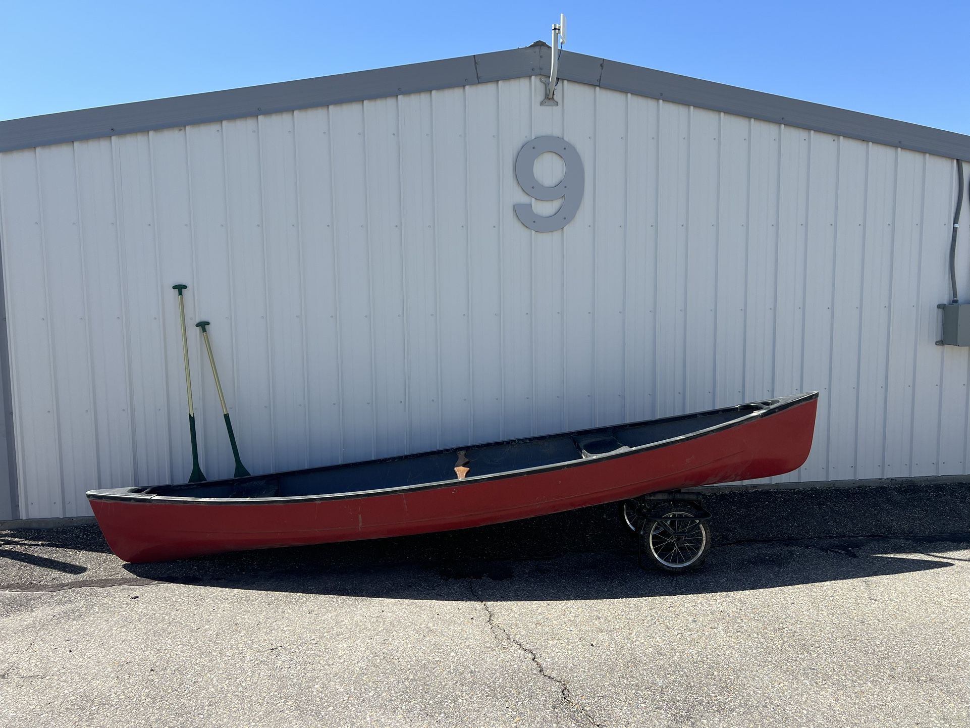 Old Town Canoe With Paddles And Pulley System.