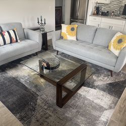Modern sofa, love seat, coffee and end table, room rug, pillows