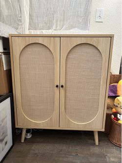 Nice decorative cabinet with doors and shelf.