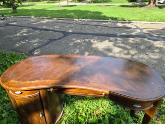 Free! Large desk, stable, solid wood, could use cosmetic work if you're fussy.