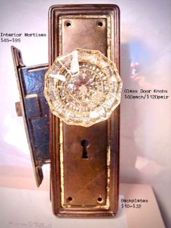 Antique mortise lock, two old glass knobs, and two backplates