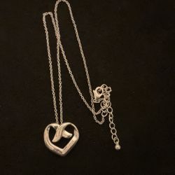 20” SilverTone Necklace With Ex And Heart Pendant..