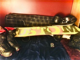 Snowboard with boots and carrying bag
