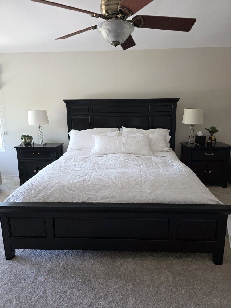 California King size bed frame with two matching nightstands and lamps