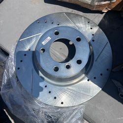 4 brand‑new, never mounted drilled/slotted brake rotors