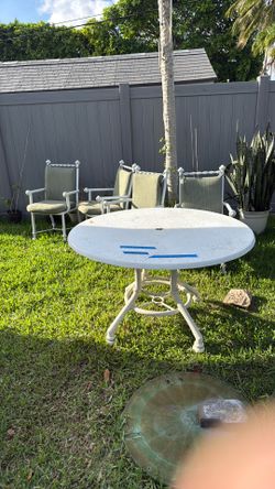 Outdoor fiberglass table with aluminum chairs w/ cushions