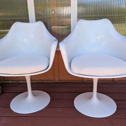 Two White Tulip Swivel Arm Chairs