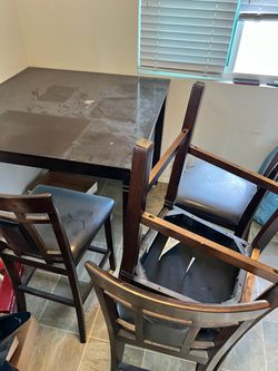 Table used comes with all four chairs