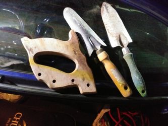 Yard and garden tools and spare handle. For saw
