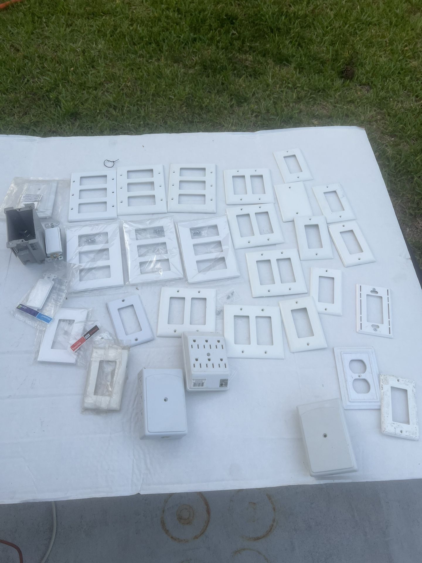 Assorted Lot Of Light Almond 3-Gang Decorator Wall-plates And Boxes. New & Used. Mix lot of new and used. Not all hardware included. Only comes as pi