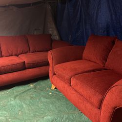 Red couch and loveseat. Good condition 300 delivery extra.