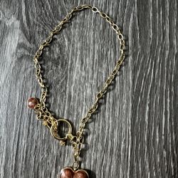 Golden short chocker with brown heart