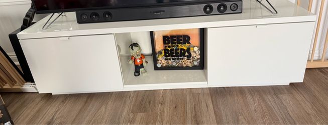 White ikea tv stand with 55 in tv