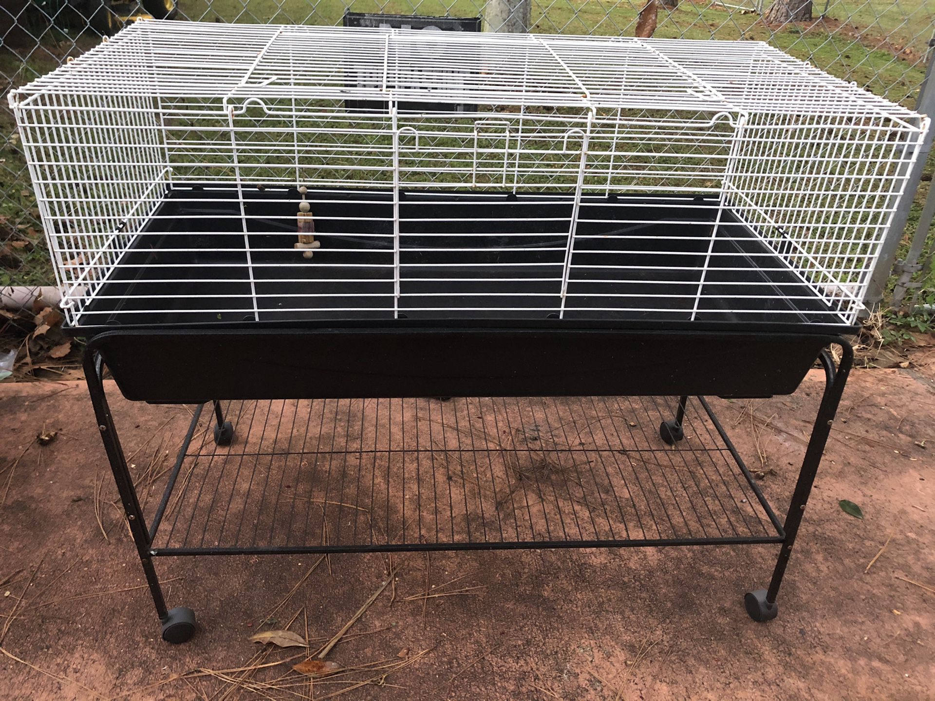 Large pet cage on rolling stand 46”x22”x39”
