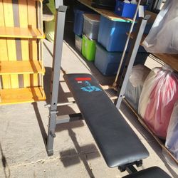 Weider ECS adjustable workout weight bench featuring a black steel frame, includes integrated rack a a leg developer (no weights or bar inclued) 