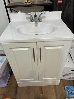 Bathroom sink with cabinet