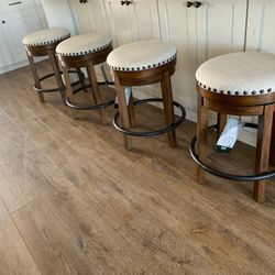 New ashley Swivel Farmhouse Barstools. $125 Each. Can Deliver And Assemble At lux In Perris Next To Winco In Perris 
