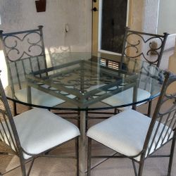 High Quality glass top table and 4 chairs.