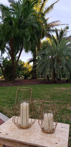 (2) Cute light weight Metal Candle Holders w/ Glass Center piece 14" H 9" H