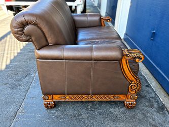 Brown Leather Sofa with Carved Wood Frame