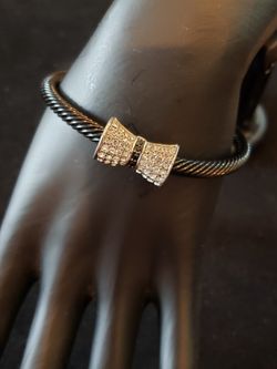 Bowtie pave CZ rhinestone black metal cuff bracelet.