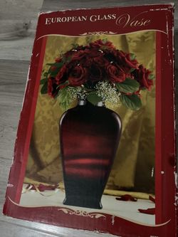 Semi new 16’ tall red vase / flowers