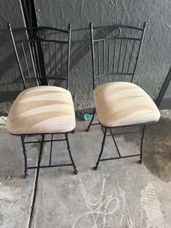 2 black dining chairs nubuck texture