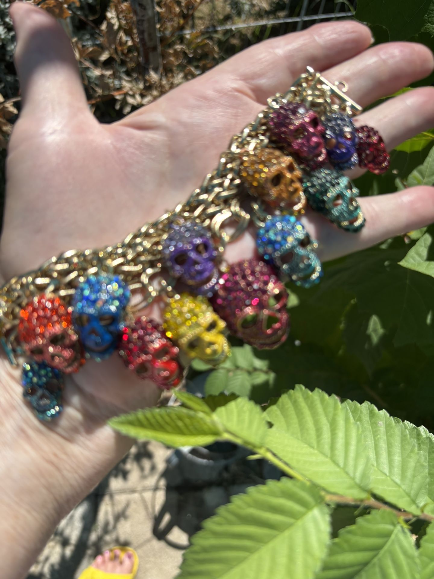 Multicolored Rhinestone Skull Bracelet with gold tone chain bracelet and adjustable length