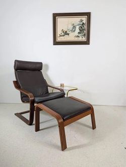 Leather Lounge Chair with footrest + additional fabric cushions
