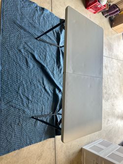Folding plastic table