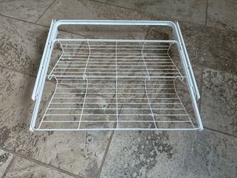 Four Elfa shoe rack shelves in white