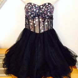 Small black corset like dress holiday !