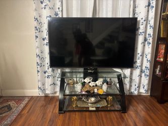 Samsung 65 inches flat screen TV with glass stand