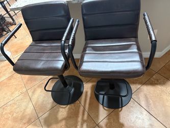 Two adjustable barstools