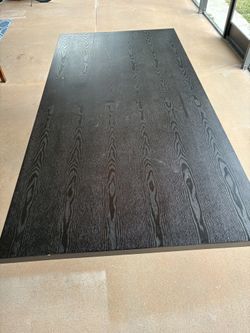 Dining table, 2 meters long and 1 meter wide, for sale for $100.