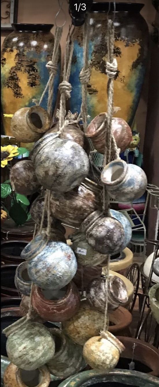 Rope string of small clay jugs $30 ea.