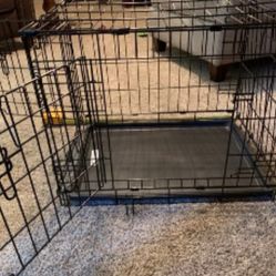 Small two entry dog/cat/animal crate. This cage has a plastic tray bottom to pull out for easy clean up. It also features an entry door on both the en