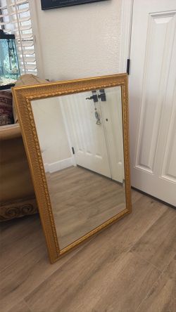 Large decorative wall mirror with gold traditional frame