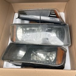 03 Chevy Avalanche Headlight Housing Full Set.