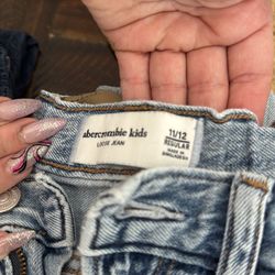 3 blue light blue both are Abercrombie kids, and old navy baggy barrel leg, used and one of them are ripped